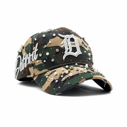 Three-quarter view of the Detroit Militia Hat showing the Old English D, Detroit side script, camo, rhinestones and pearls