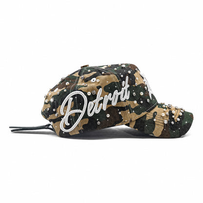 Side view of the Detroit Militia Hat with rhinestone Detroit script, woodland camo and pearl embellishments