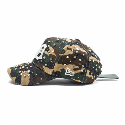 MTH logo side view of the Detroit Militia Hat showing woodland camo, rhinestones, pearls and the distressed brim
