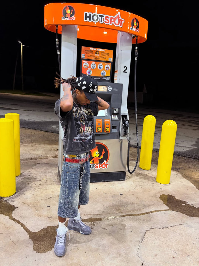 Customer wearing the LALA Land Hat at a gas station