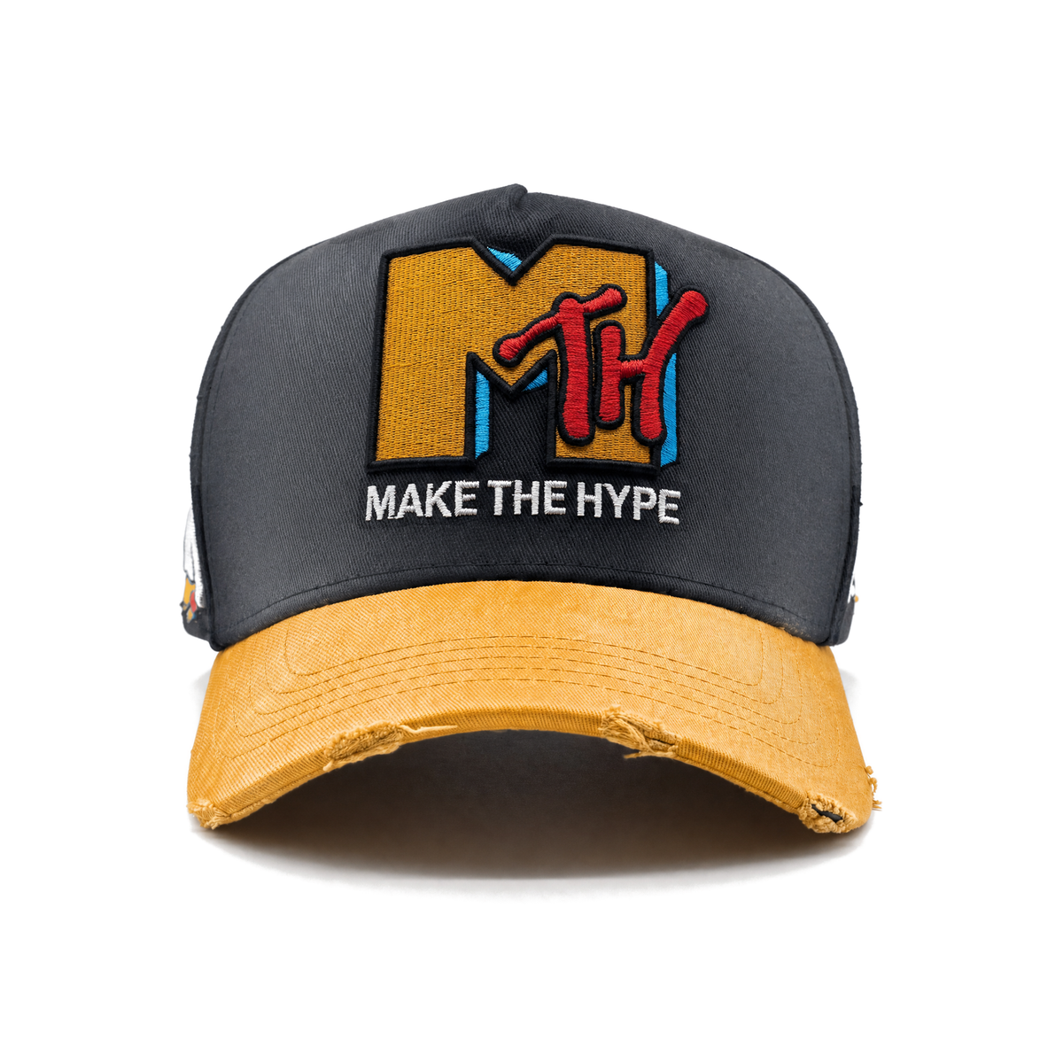 Front view of MAKE THE HYPE TV with a faded charcoal crown and warm golden-yellow brim with pale streaks following the cotton twill